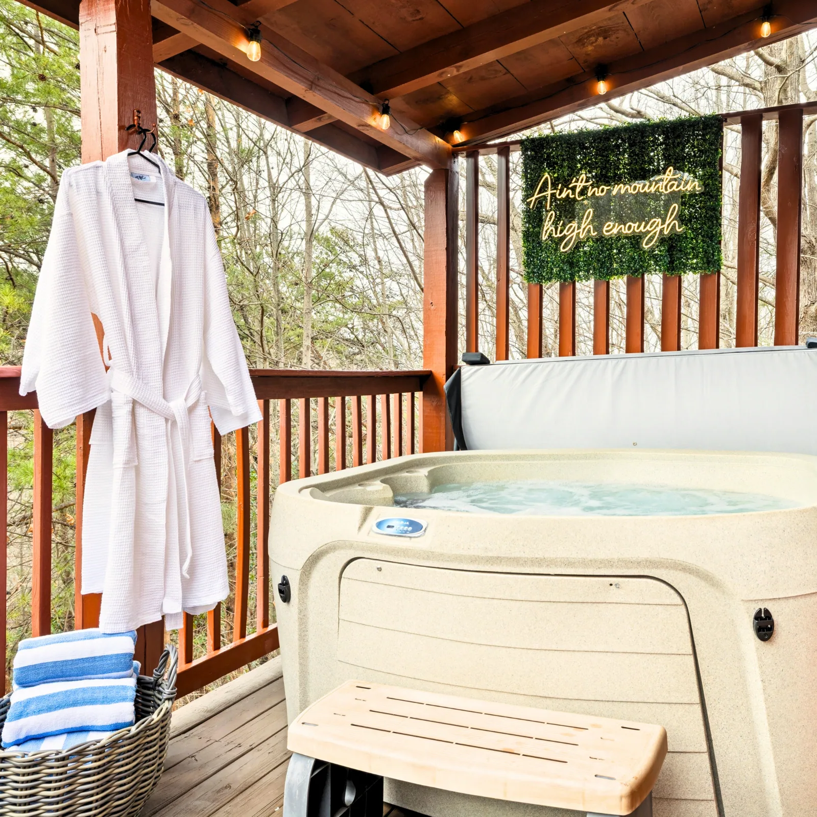 Private hot tub on the covered deck at Three Bears Cabin
